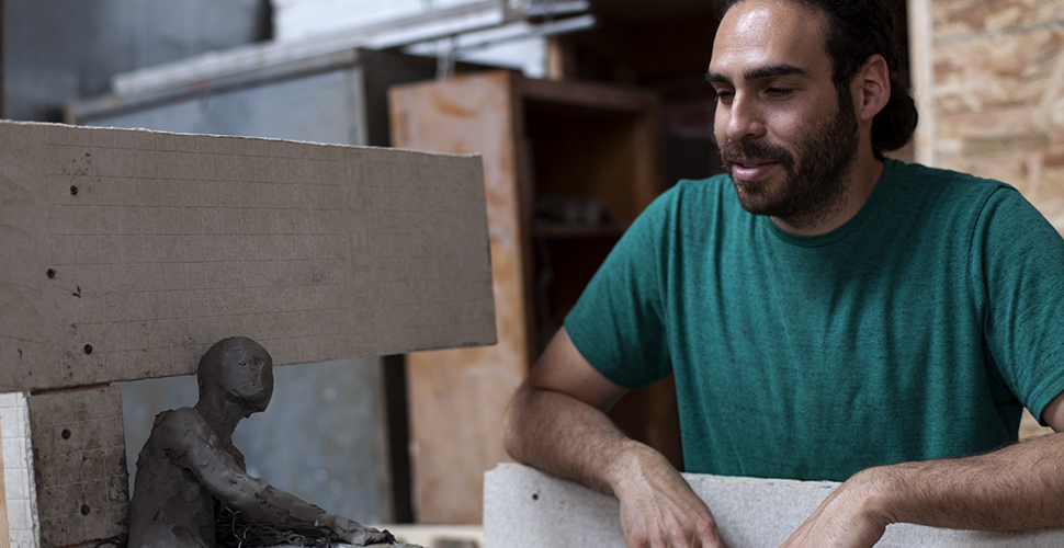 Miguel Antonio Horn working on a sculpture at NextFab