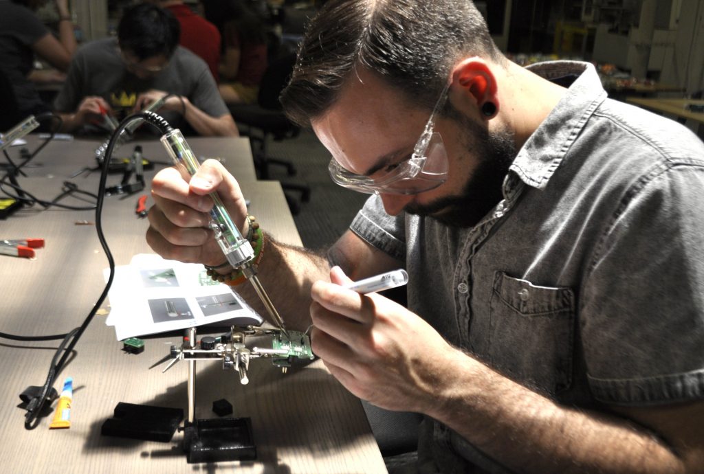 Soldering circuitry for the LipSync device at NextFab makerspace