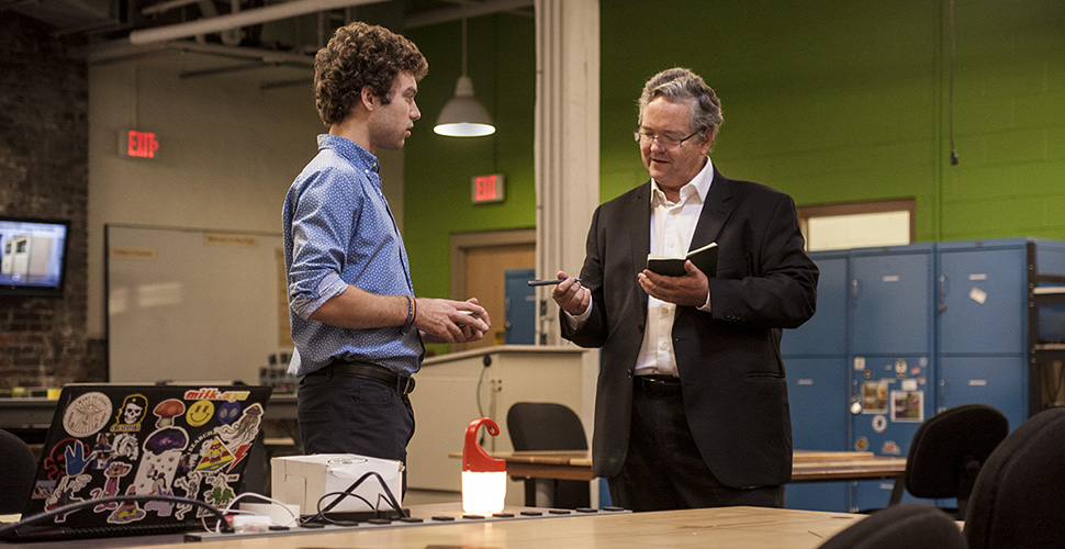 Make Magazine founder, Dale Dougherty reviewing prototypes made by RAPID participant.