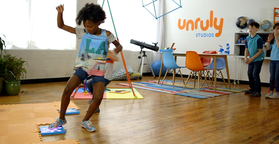 Children playing with Splat tiles at Unruly Studios