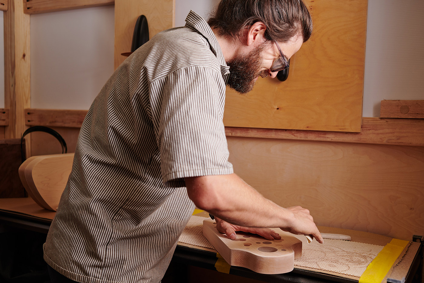 Modern & Homey - Photo of Cody Hughes of Untitled_Co working on furniture design