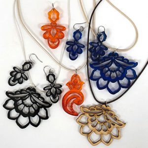 Linda Celestian - contemporary laser-cut acrylic and wood pendants and earrings 1